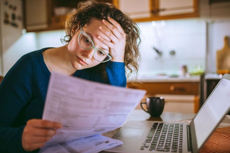 Person experiencing financial stress and credit problems
